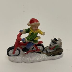 Celebrations Christmas Village Snowy Boy On Bike With Dog 2” Tall Glittery Snow